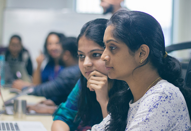 Devlopers pairing on a laptop in our Bangalore office